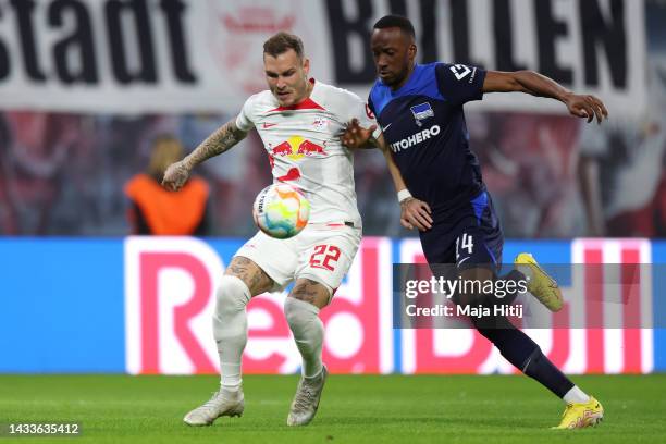 David Raum of RB Leipzig is challenged by Dodi Lukebakio of Hertha Berlin during the Bundesliga match between RB Leipzig and Hertha BSC at Red Bull...