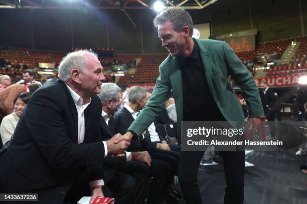 Julian Nagelsmann, head coach of FC Bayern München welcomes Uli Honess , Honorary President of FC Bayern München during the annual general meeting of...