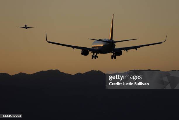 Planes land and take off from Harry Reid International Airport on October 14, 2022 in Las Vegas, Nevada. Holiday airfare prices are expected to be...