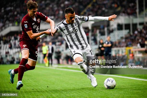 Filip Kostic of Juventus battles for the ball with Alexey Miranchuk of Torino FC during the Serie A match between Torino FC and Juventus at Stadio...