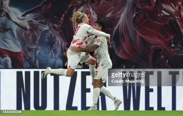 Emil Forsberg of RB Leipzig celebrates with teammate Dominik Szoboszlai after scoring their side's first goal during the Bundesliga match between RB...