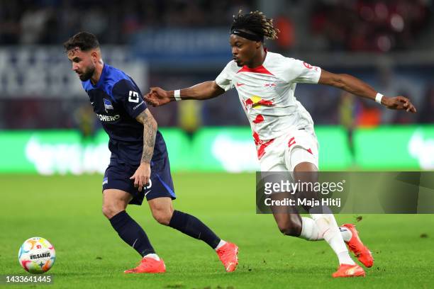 Marco Richter of Hertha Berlin is challenged by Mohamed Simakan of RB Leipzig during the Bundesliga match between RB Leipzig and Hertha BSC at Red...