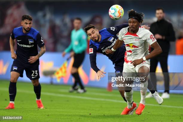 Amadou Haidara of RB Leipzig is challenged by Suat Serdar of Hertha Berlin during the Bundesliga match between RB Leipzig and Hertha BSC at Red Bull...