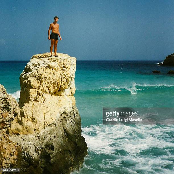 man standing on rocks - 1996 stock pictures, royalty-free photos & images