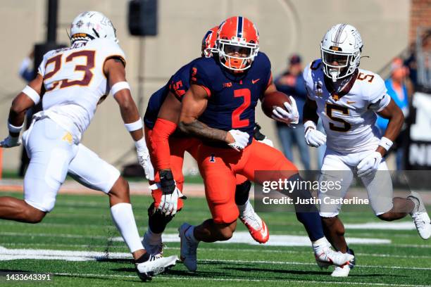 Chase Brown of the Illinois Fighting Illini runs the ball during the first quarter in the game against the Minnesota Golden Gophers at Memorial...