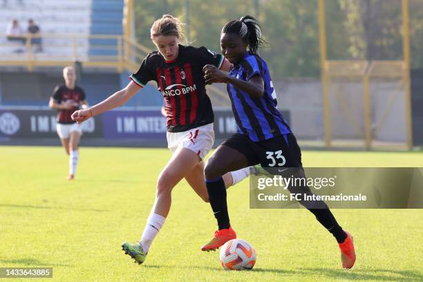 Ajara Nchout of Inter Women competes for the ball with Christy Grimshaw of AC Milan Women during the Serie A Women match between FC Internazionale...