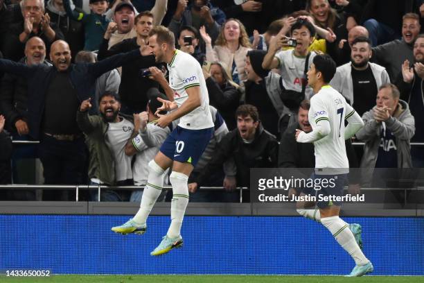 Harry Kane of Tottenham Hotspur celebrates after scoring their team's first goal from the penalty spot during the Premier League match between...