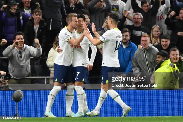 Harry Kane of Tottenham Hotspur celebrates with teammates after scoring their team's first goal from the penalty spot during the Premier League match...