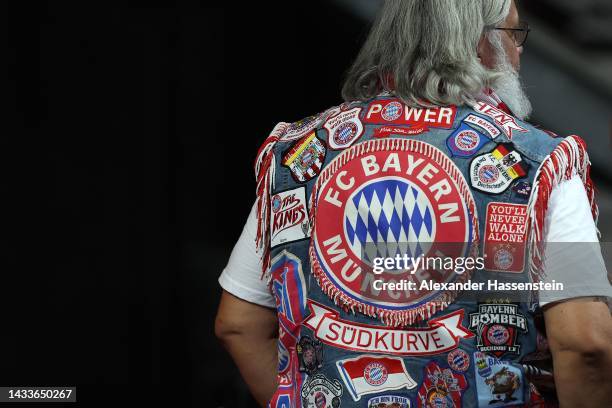 Bayern München supporter wears supporter vest during the annual general meeting of football club FC Bayern Muenchen at Audi Dome on October 15, 2022...