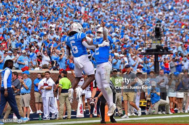 Zach Evans of the Mississippi Rebels and Jaxson Dart celebrate during the first half against the Auburn Tigers at Vaught-Hemingway Stadium on October...