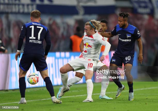 Emil Forsberg of RB Leipzig is challenged by Chidera Ejuke of Hertha Berlin during the Bundesliga match between RB Leipzig and Hertha BSC at Red Bull...