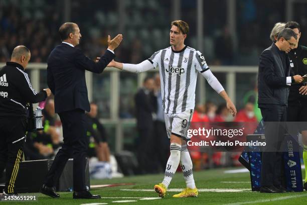 Dusan Vlahovic of Juventus interacts with Massimiliano Allegri, Head Coach of Juventus during the Serie A match between Torino FC and Juventus at...