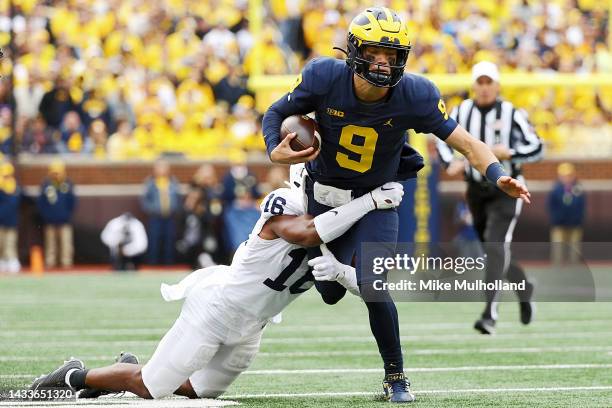 McCarthy of the Michigan Wolverines is tackled by Ji'Ayir Brown of the Penn State Nittany Lions in the first half of a game at Michigan Stadium on...