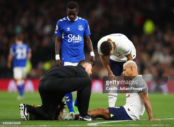 Richarlison of Tottenham Hotspur receives medical treatment during the Premier League match between Tottenham Hotspur and Everton FC at Tottenham...
