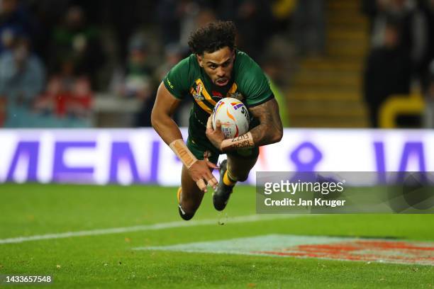 Josh Addo-Carr of Australia dives to score their side's second try during the Rugby League World Cup 2021 Pool B match between Australia and Fiji at...