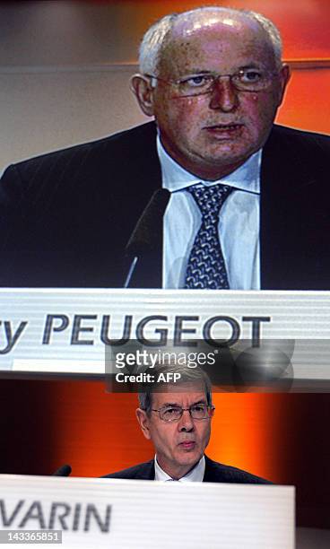 French carmaker PSA Peugeot Citroen Chairman Philippe Varin listens as Thierry Peugeot, Chairman of the Supervisory Board addresses the group's...
