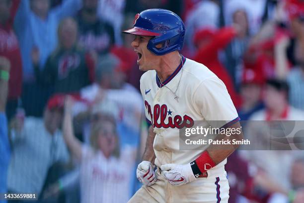 Realmuto of the Philadelphia Phillies celebrates an in the park home run against the Atlanta Braves during the third inning in game four of the...