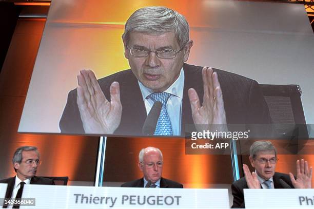 French carmaker PSA Peugeot Citroen Chairman Philippe Varin addresses the group's shareholders general meeting at PSA headquarters in Paris on April...