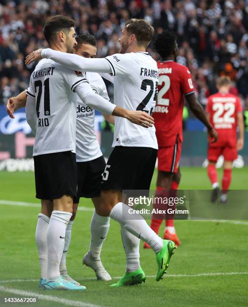 Lucas Alario of Eintracht Frankfurt scores their team's fifth goal with teammates during the Bundesliga match between Eintracht Frankfurt and Bayer...