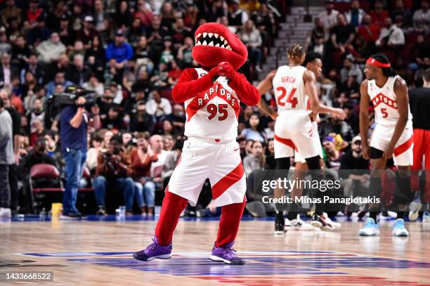 Toronto Raptors' mascot, The Raptor, entertains spectators during the second half of a preseason NBA game between the Toronto Raptors and the Boston...