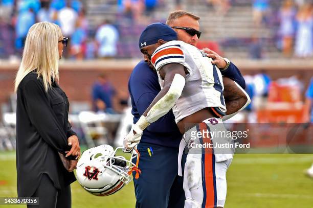 Head coach Bryan Harsin of the Auburn Tigers embraces Tank Bigsby of the Auburn Tigers after the game against the Mississippi Rebels at...