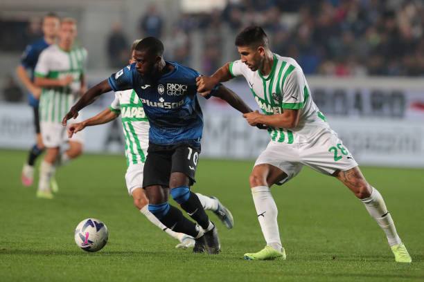 Jeremie Boga of Atalanta BC battles for possession with Martin Erlic and Maxime Lopez of US Sassuolo during the Serie A match between Atalanta BC and...