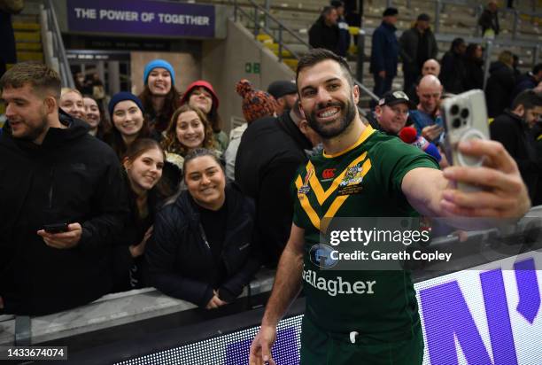 James Tedesco of Australia takes a selfie with fans following the Rugby League World Cup 2021 Pool B match between Australia and Fiji at Headingley...