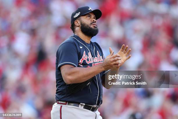 Kenley Jansen of the Atlanta Braves reacts to a home run by Bryce Harper of the Philadelphia Phillies during the eighth inning in game four of the...