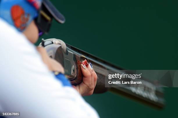 The painted fingernails from Yukie Nakayama of Japan are seen during the Women's Trap Qualification on day seven of the ISSF Shooting World Cup LOCOG...