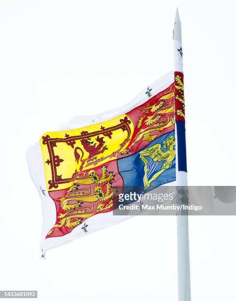 The Royal Standard, with a Bordure Ermine, flies above Ascot Racecourse as Camilla, Queen Consort attends QIPCO British Champions Day at Ascot...
