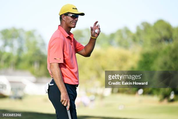 John Senden of Australia waves to the crowd on the 18th green during the second round of the SAS Championship at Prestonwood Country Club on October...