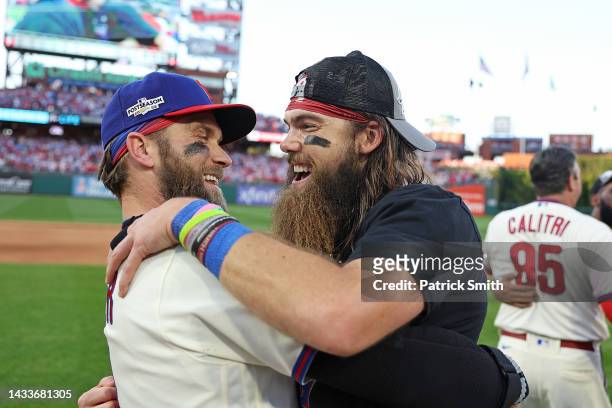 Brandon Marsh and Bryce Harper of the Philadelphia Phillies celebrate after defeating the Atlanta Braves in game four of the National League Division...