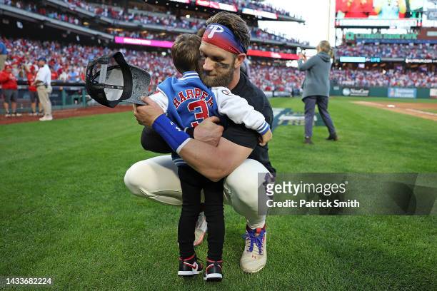 Bryce Harper of the Philadelphia Phillies hugs his child Krew Harper after defeating the Atlanta Braves in game four of the National League Division...