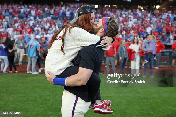 Bryce Harper of the Philadelphia Phillies hugs his wife Kayla Harper after defeating the Atlanta Braves in game four of the National League Division...