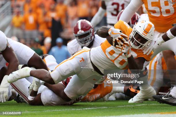 Tight end Princeton Fant of the Tennessee Volunteers scores a touchdown in the second quarter against the Alabama Crimson Tide at Neyland Stadium on...