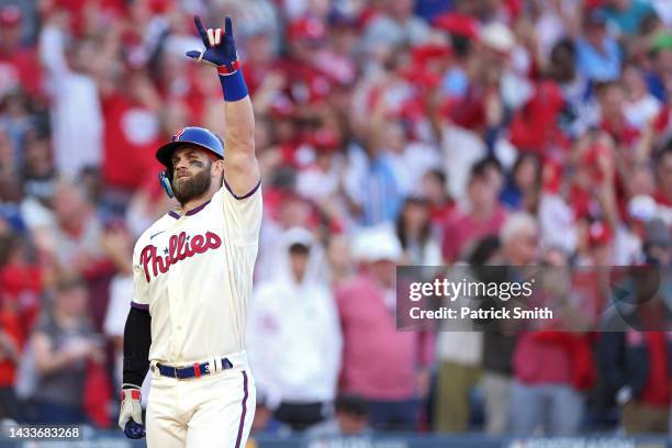 Bryce Harper of the Philadelphia Phillies celebrates a home run against the Atlanta Braves during the eighth inning in game four of the National...