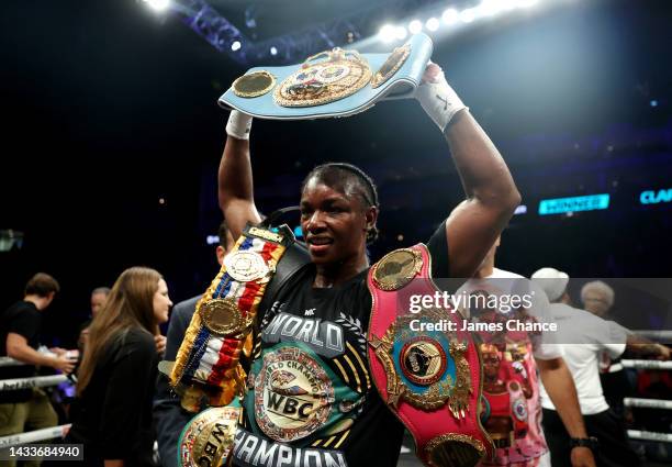 Claressa Shields poses with the IBF, WBA, WBC, WBO World Middleweight Title belts after victory in the IBF, WBA, WBC, WBO World Middleweight Title...