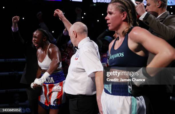 Claressa Shields celebrates as she is declared winner on points as Savannah Marshall watches on after the IBF, WBA, WBC, WBO World Middleweight Title...