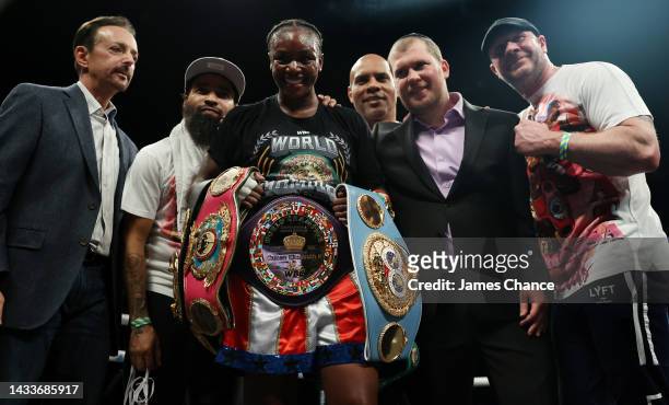 Claressa Shields and trainers pose with the WBC Elizabethan Belt and IBF, WBA, WBC, WBO World Middleweight Title belts after victory in the IBF, WBA,...
