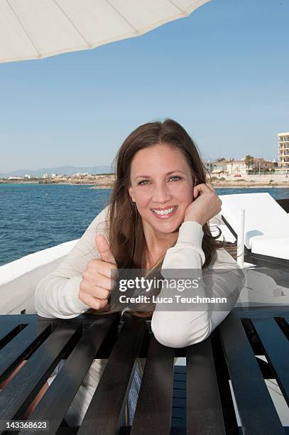 Dana Schweiger poses during a portrait session at the Puro Beach Club Palma de Mallorca on March 31, 2012 in Palma de Mallorca, Spain.