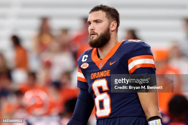 Garrett Shrader of the Syracuse Orange warms up prior to a game against the North Carolina State Wolfpack at JMA Wireless Dome on October 15, 2022 in...