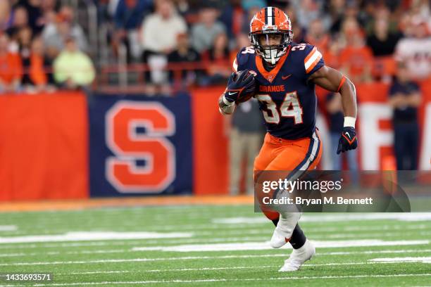 Sean Tucker of the Syracuse Orange runs the ball during the third quarter against the North Carolina State Wolfpack at JMA Wireless Dome on October...