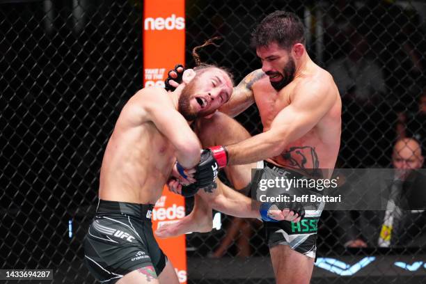 Raphael Assuncao of Brazil knees Victor Henry in a bantamweight fight during the UFC Fight Night event at UFC APEX on October 15, 2022 in Las Vegas,...