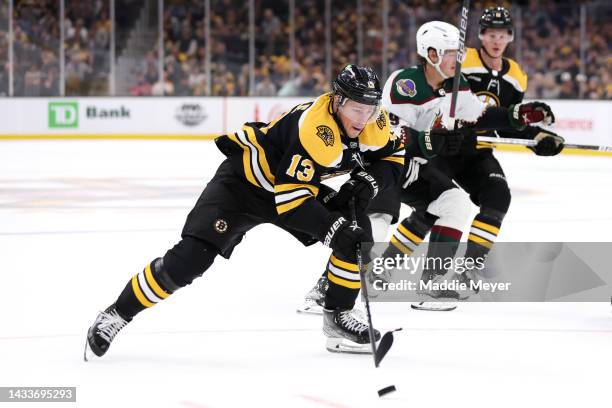 Charlie Coyle of the Boston Bruins takes a shot against the Arizona Coyotes to score during the first period at TD Garden on October 15, 2022 in...