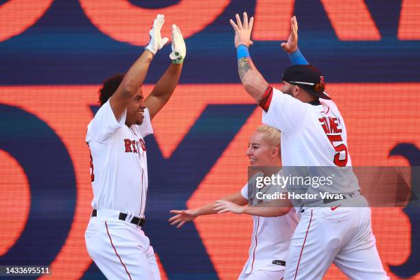 Jonny Gomes, Liv Cooke, and Enmanuel Valdez of the Boston Red Sox celebrate victory after the FTX MLB Home Run Derby X at Campo Marte on October 15,...