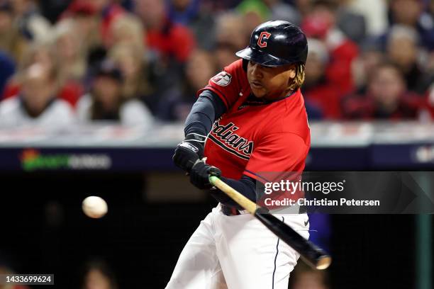 Jose Ramirez of the Cleveland Guardians hits a single during the first inning against the New York Yankees in game three of the American League...