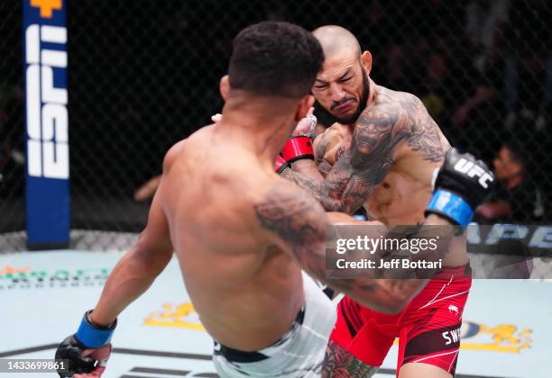 Jonathan Martinez kicks Cub Swanson in a bantamweight fight during the UFC Fight Night event at UFC APEX on October 15, 2022 in Las Vegas, Nevada.