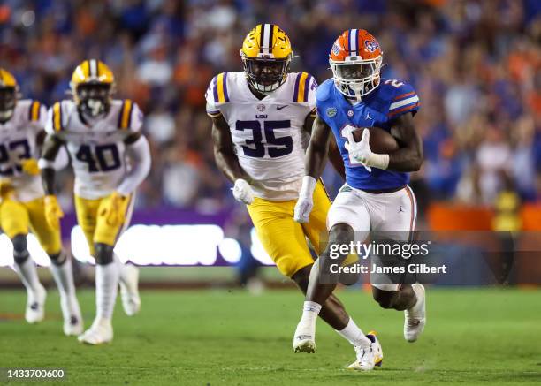Montrell Johnson Jr. #2 of the Florida Gators runs the ball during the first half of a game against the LSU Tigers at Ben Hill Griffin Stadium on...