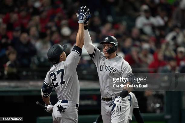 Aaron Judge of the New York Yankees celebrates with Giancarlo Stanton after hitting a two run home run during the third inning against the Cleveland...