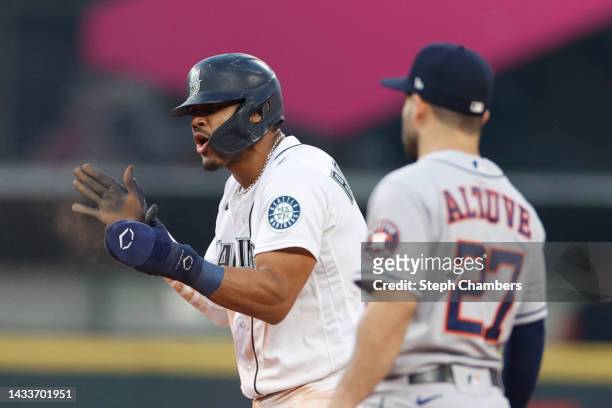 Julio Rodriguez of the Seattle Mariners steals second base during the thirteenth inning against the Houston Astros in game three of the American...
